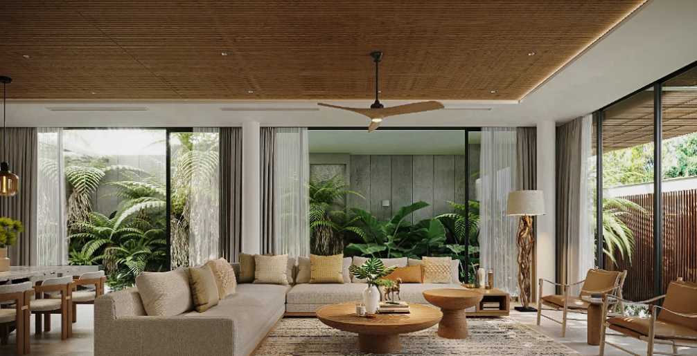 Thiết kế phòng khách biệt thự Modern Tropical với sofa chữ L lớn và vách kính panorama hướng vườn